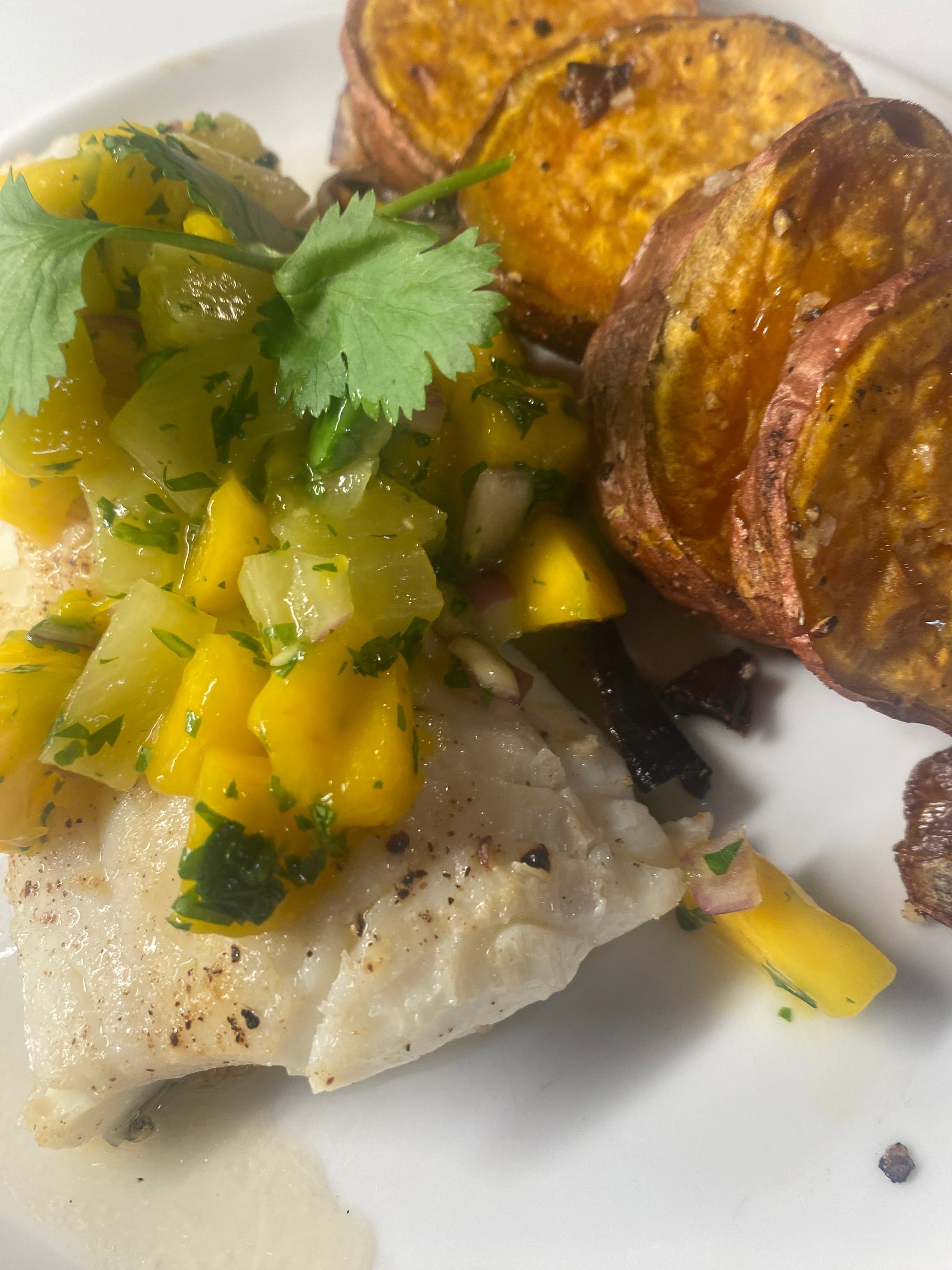 mango pineapple salsa on pan-seared cod with roasted sweet potatoes